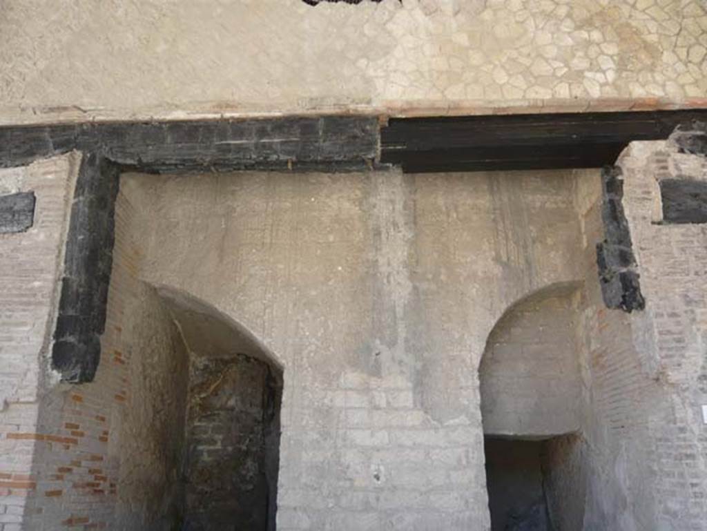 Decumanus Maximus, Herculaneum. August 2013. Detail from doorways numbered 4 and 5. Photo courtesy of Buzz Ferebee.